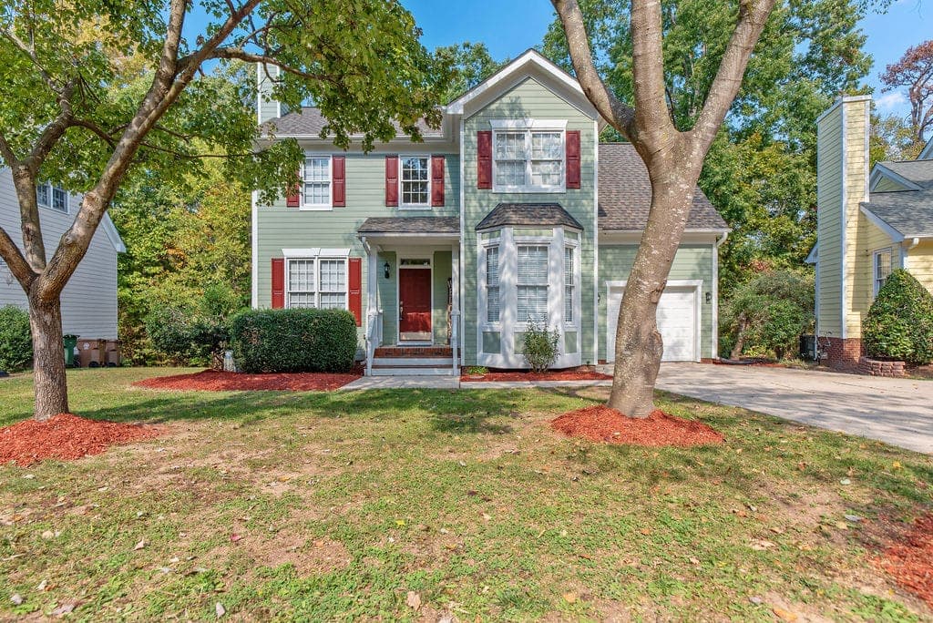 Established residential neighborhood street of single-family homes in the Triangle